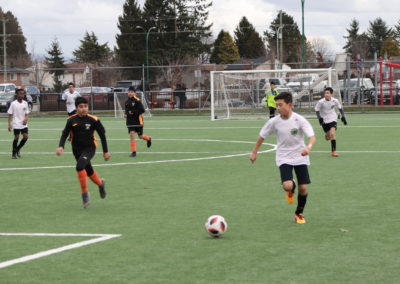 Youth playing soccer