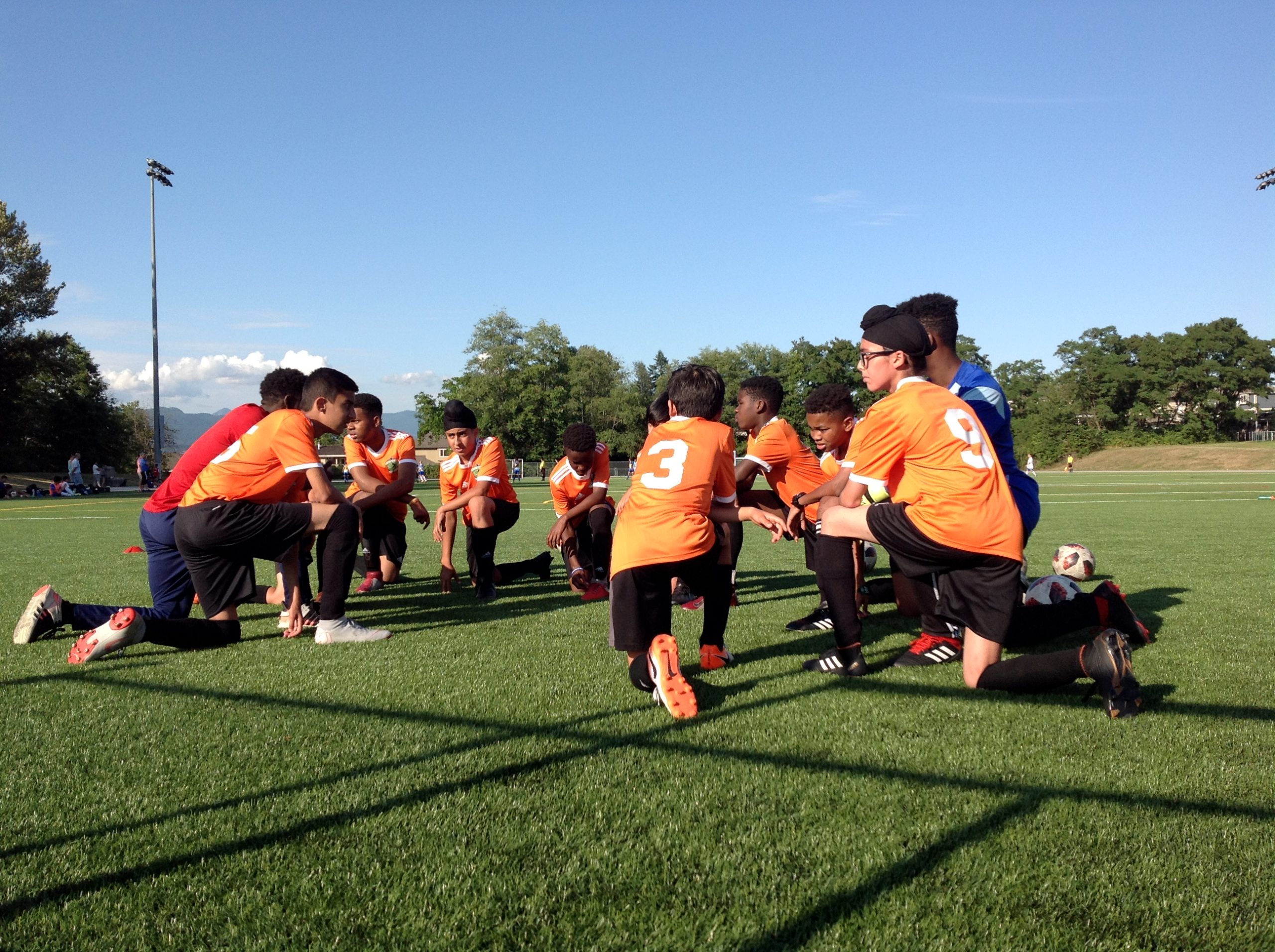 Kids kneeling in Soccer